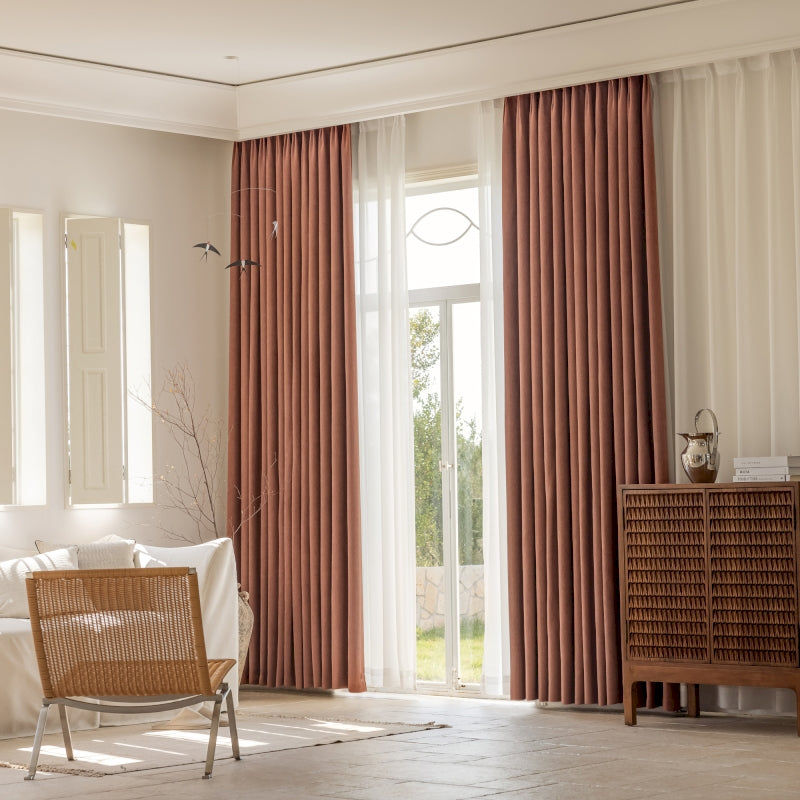 a living room filled with furniture and a large window