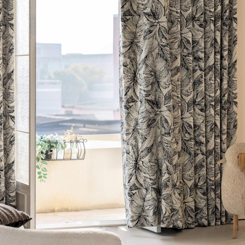 a chair sitting in front of a window next to a window