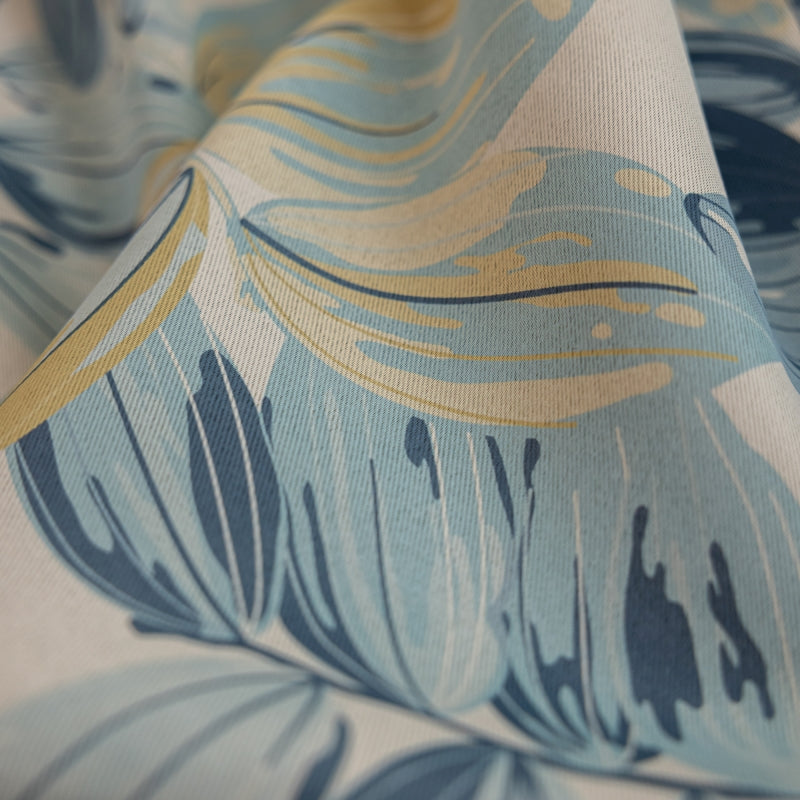 a close up of a blue and yellow fabric