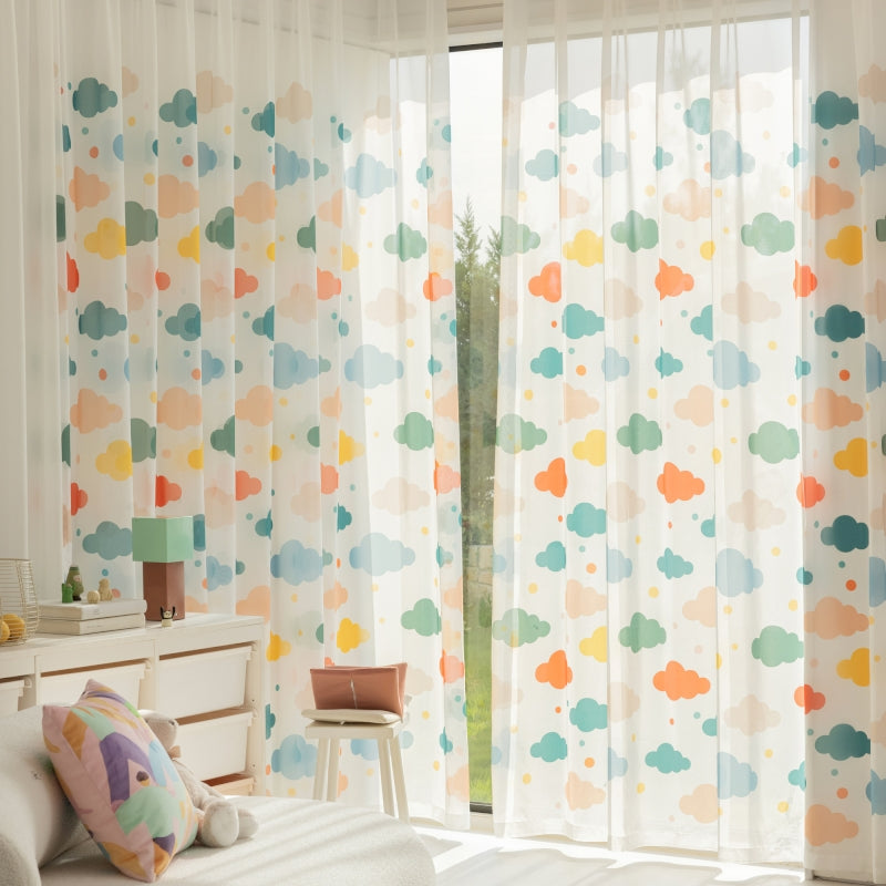 a bedroom with a white bed and a colorful curtain