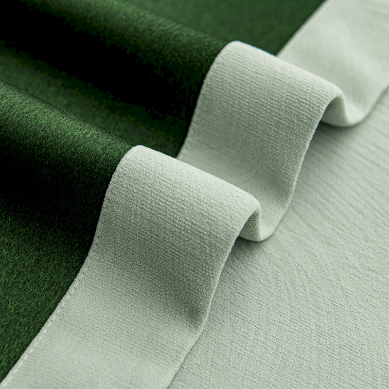 a close up of a green and white fabric