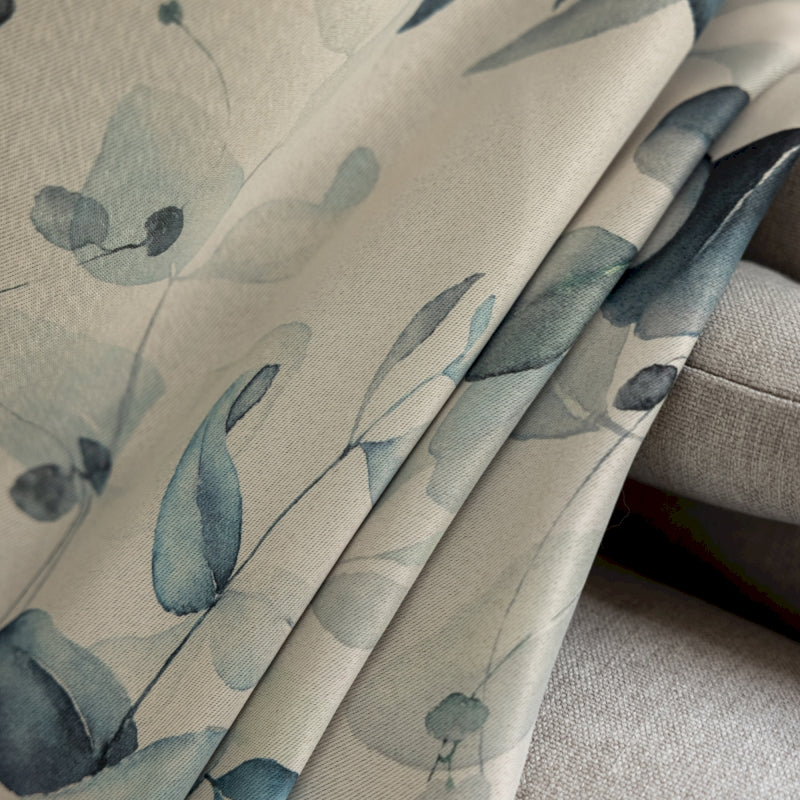 a close up of a fabric with blue flowers on it