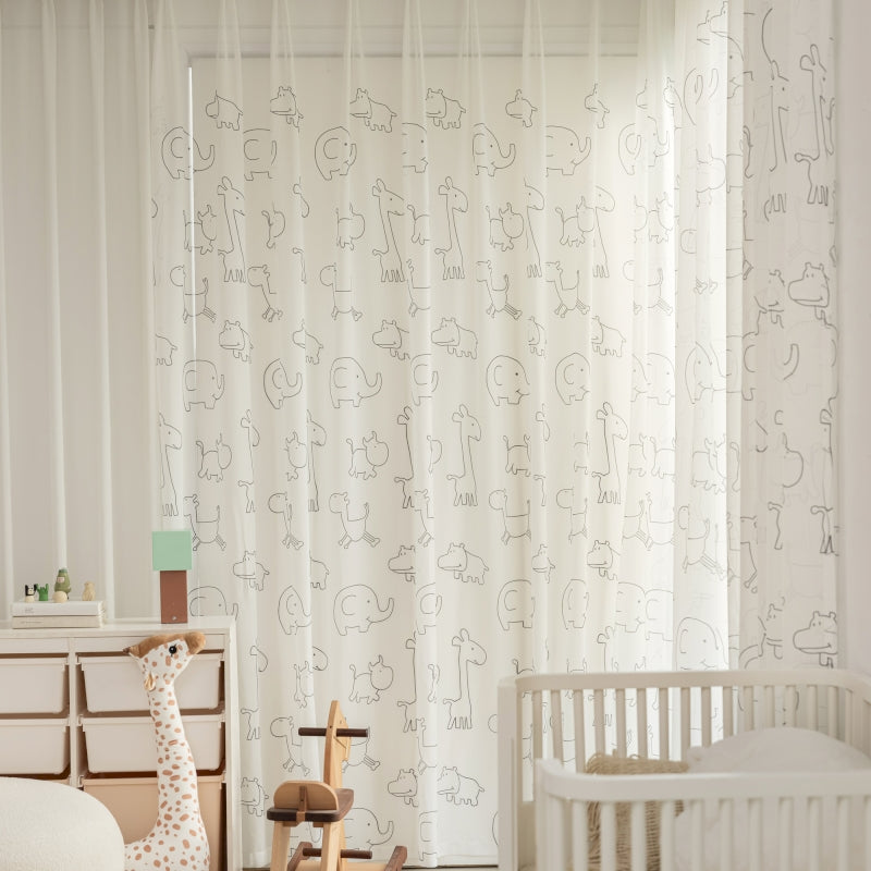 a baby's room with a crib and rocking horse