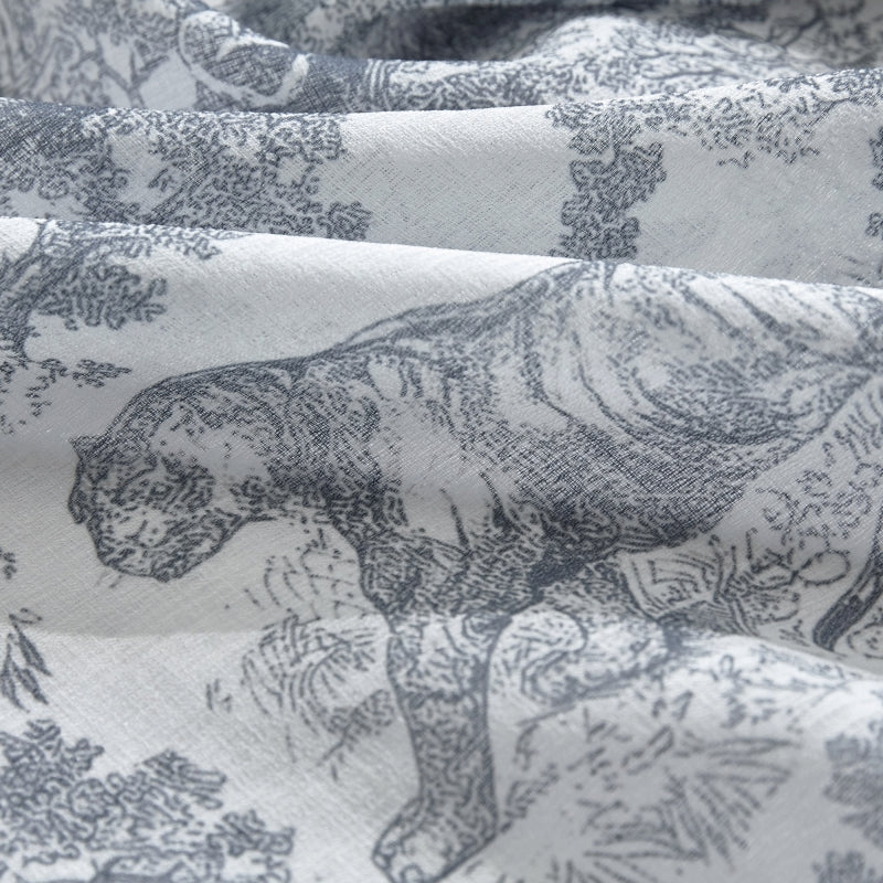 a close up of a fabric with animals on it