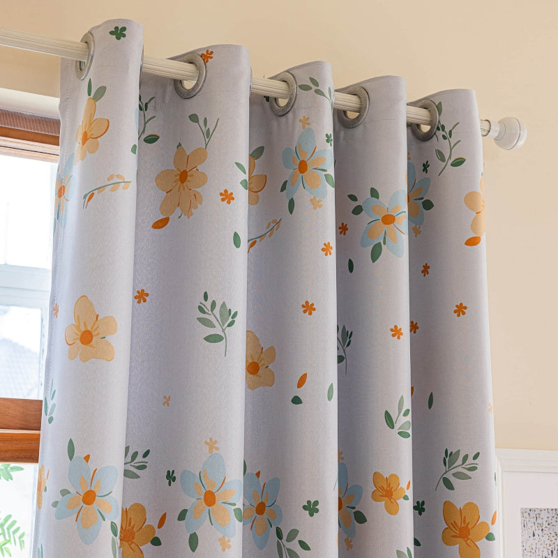 a close up of a curtain with flowers on it