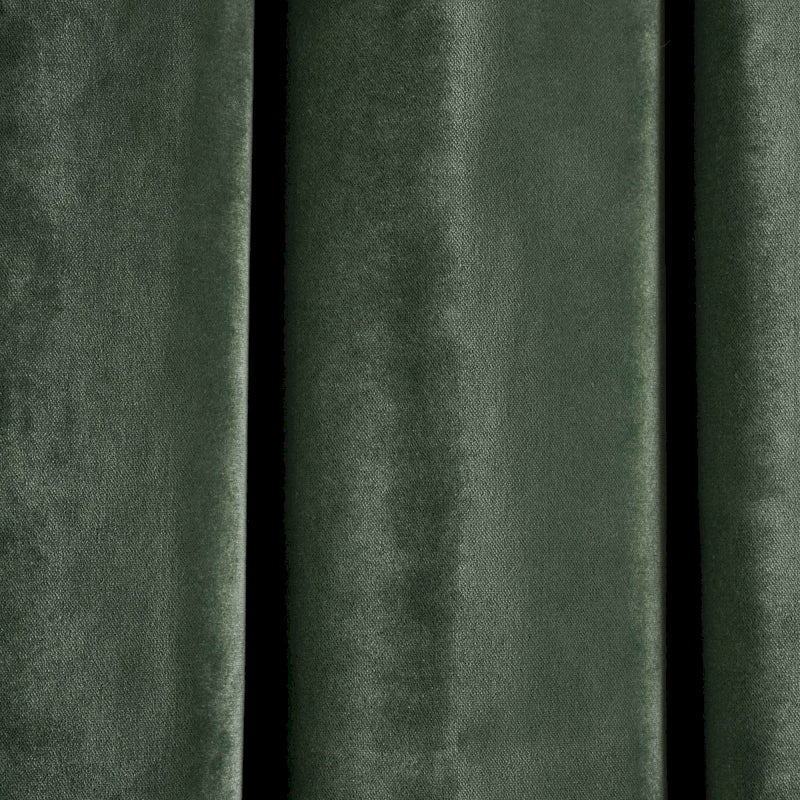 a close up of a green velvet curtain