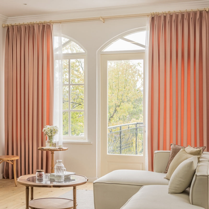 a living room filled with furniture and a large window