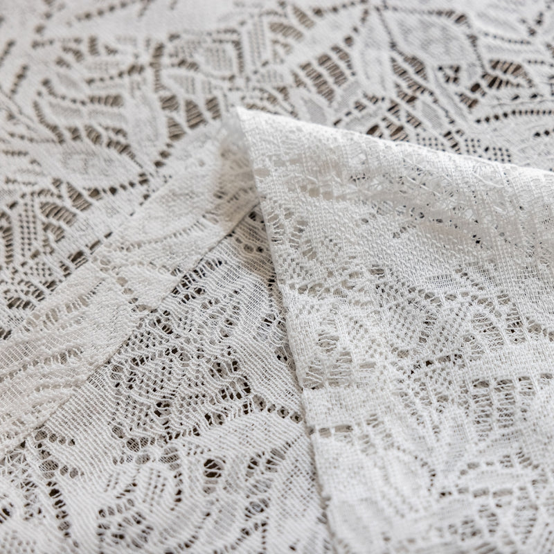 a close up of a white lace fabric