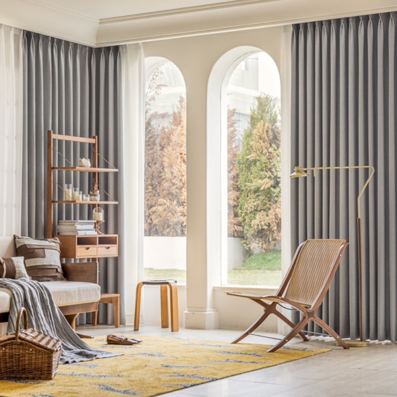 a living room filled with furniture and a large window