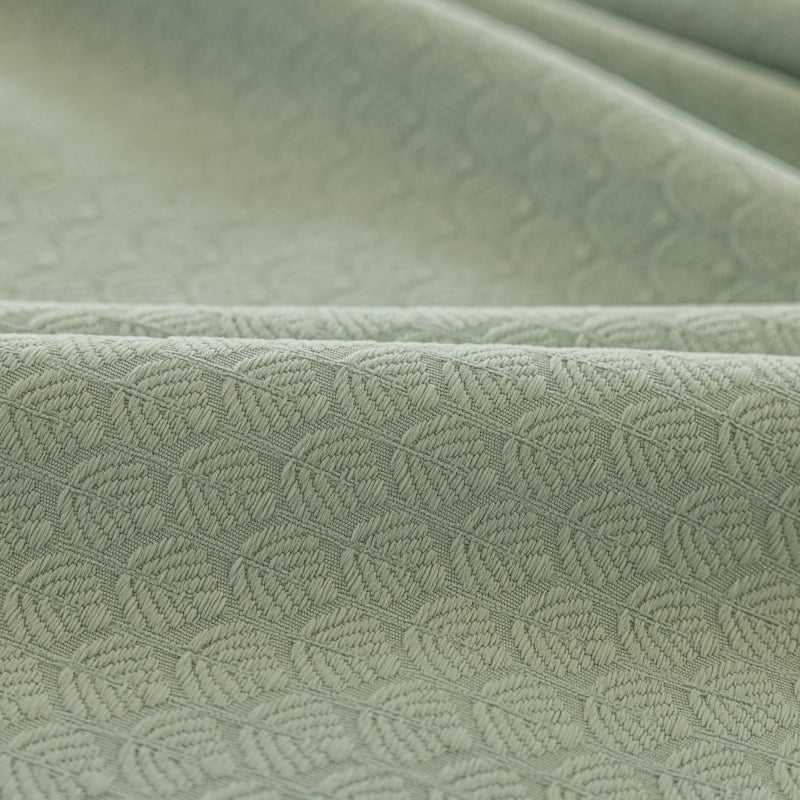 a close up shot of a green fabric
