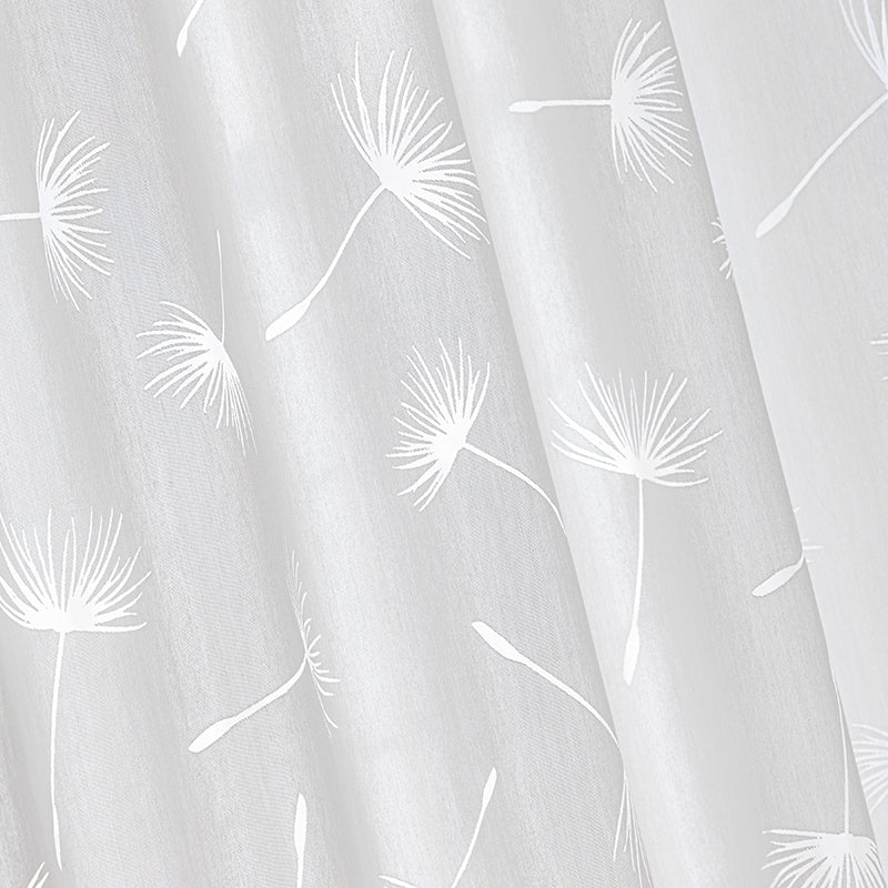 a white curtain with a dandelion pattern on it