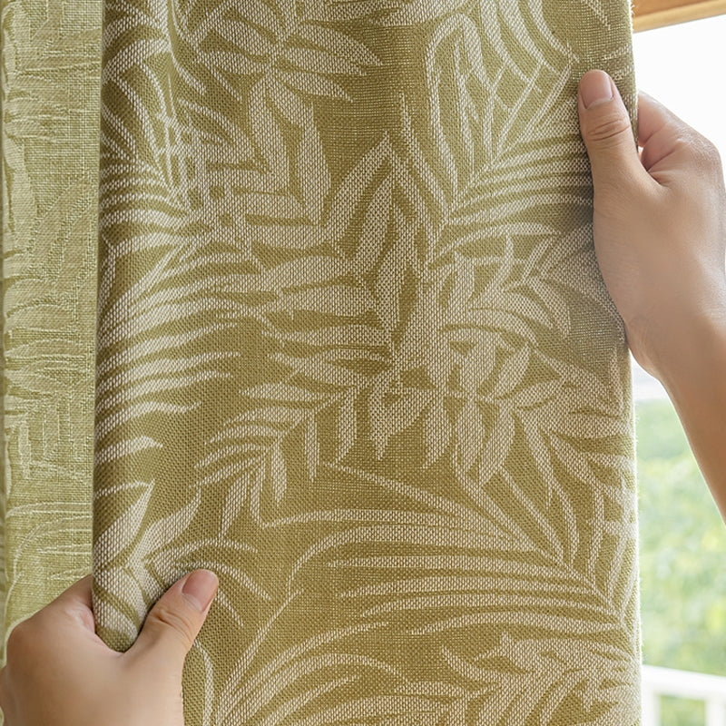 a person is pulling up a curtain with their hands