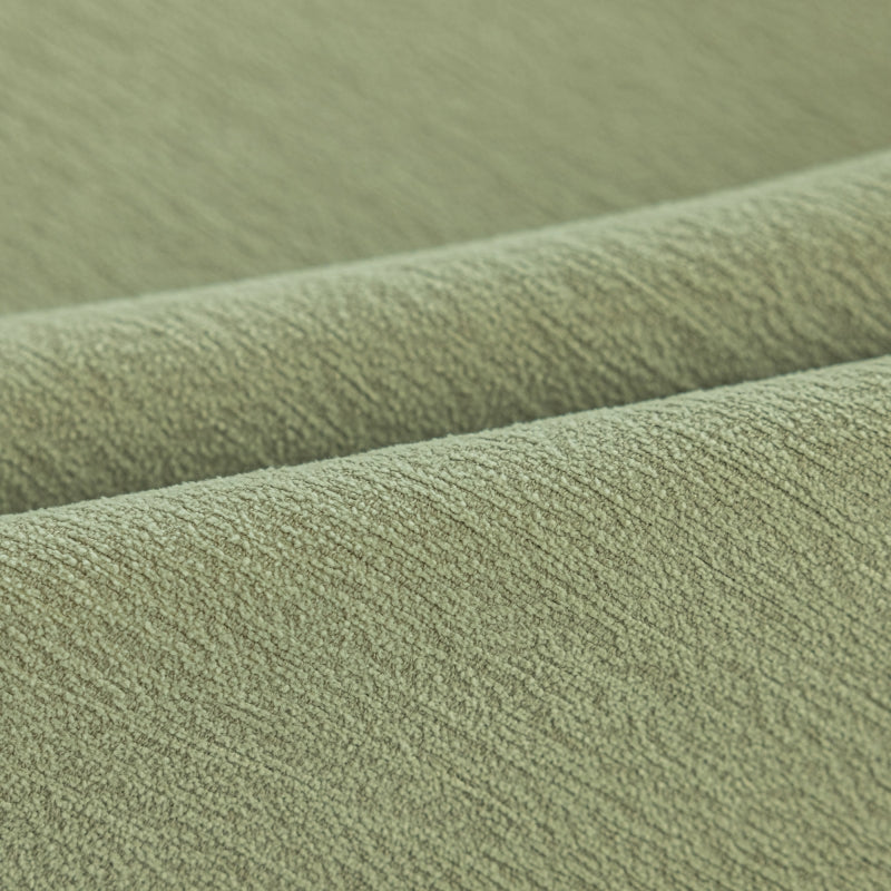 a close up view of a green fabric