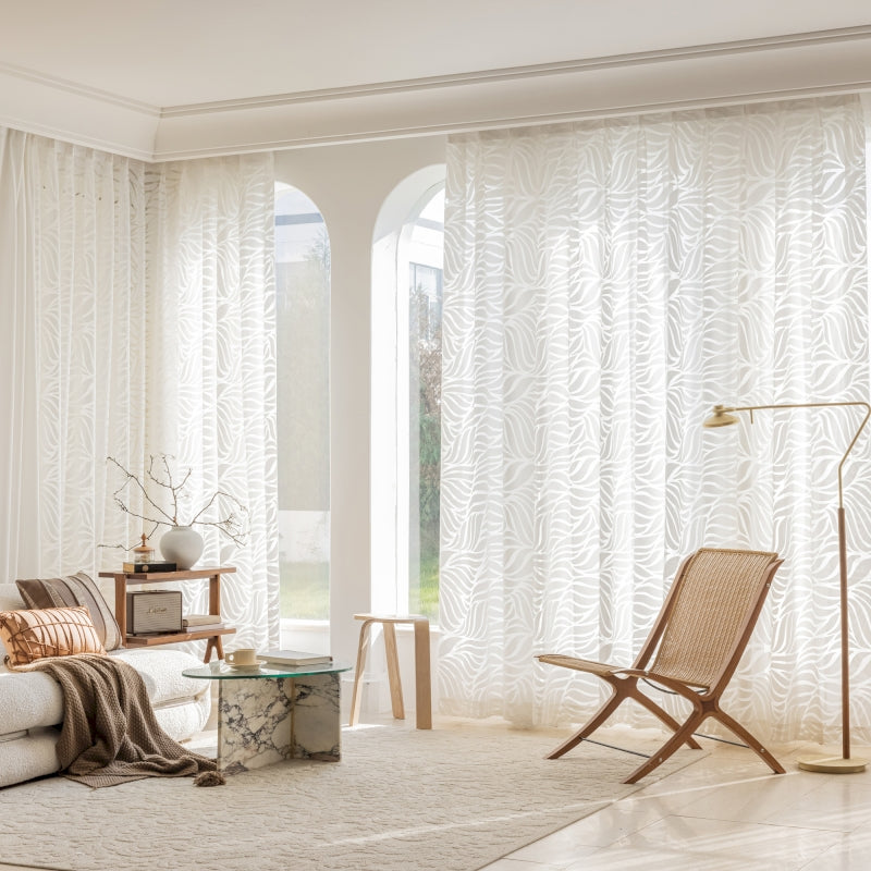 a living room filled with furniture and a large window