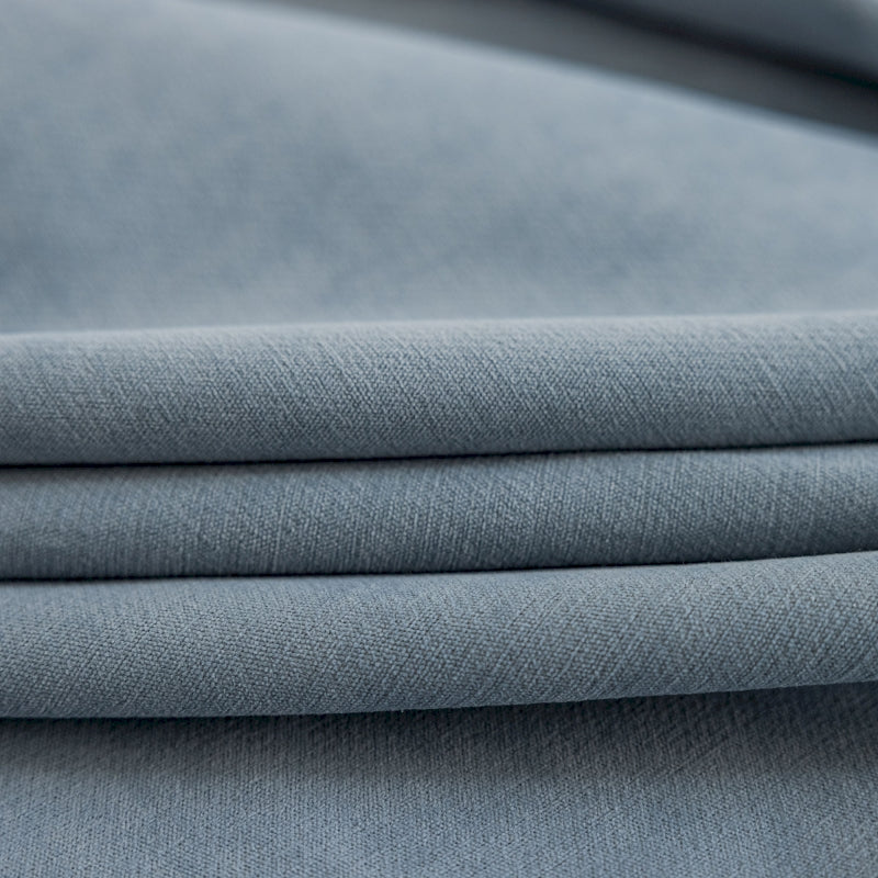 a close up shot of a plain blue fabric