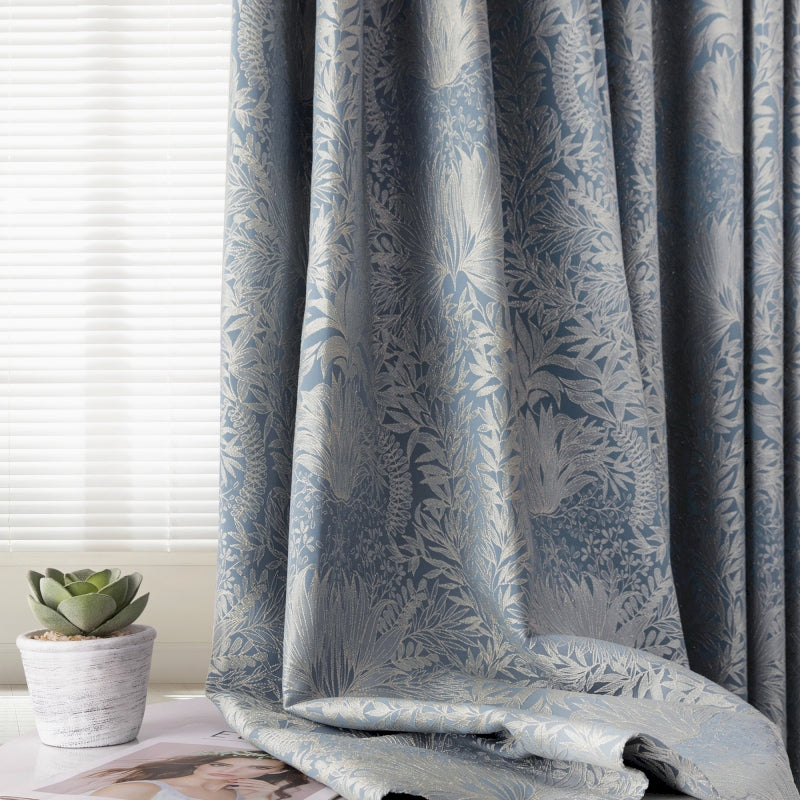 a curtain with a blue and white floral pattern