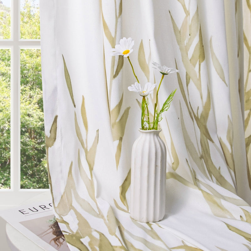 a white vase filled with flowers on top of a window sill