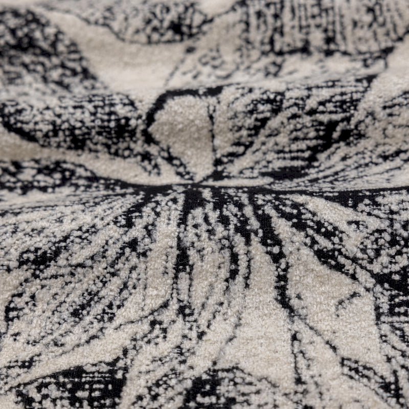 a close up of a black and white area rug