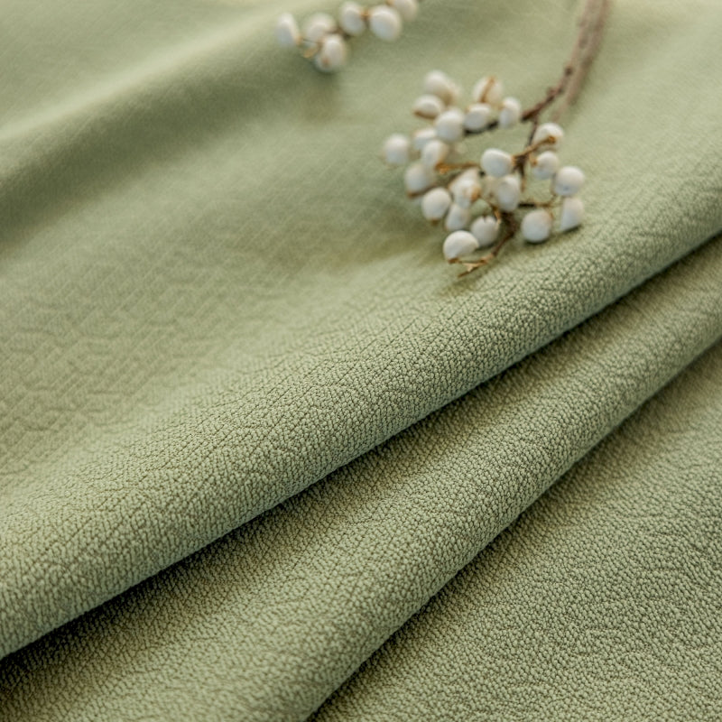 a close up of a cloth with a flower on it
