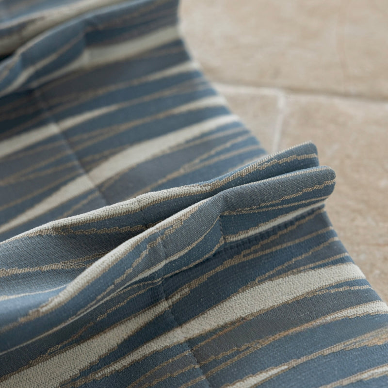 a close up of a blue and white striped fabric