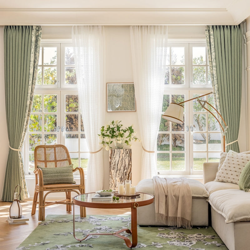 a living room filled with furniture and a large window