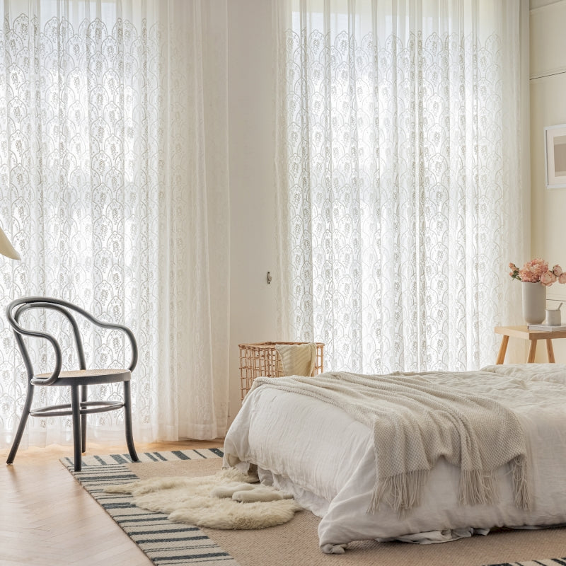 a bedroom with a bed and a chair