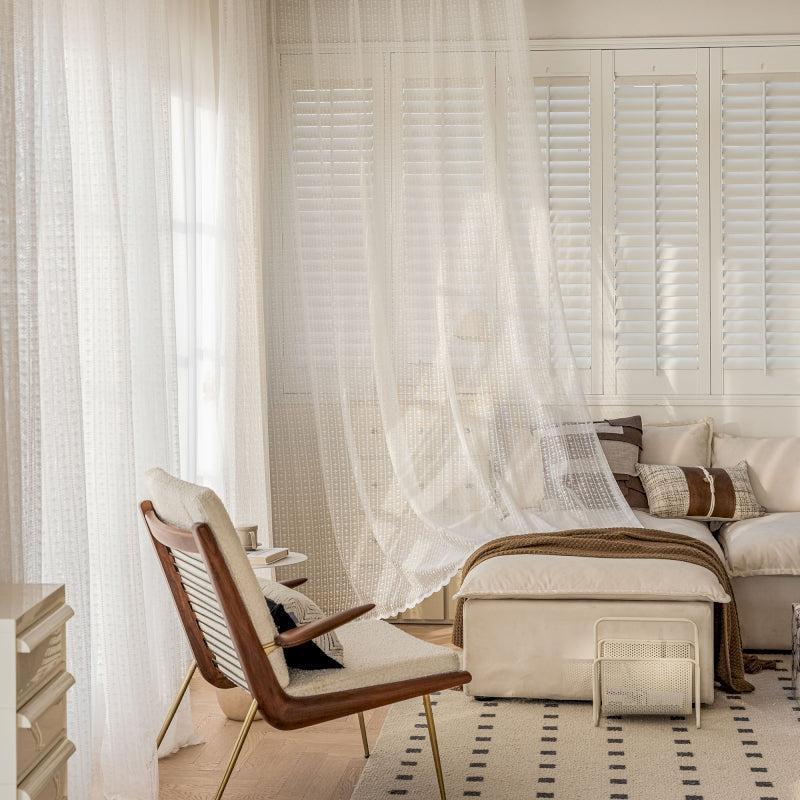 a bedroom with a bed and a chair in it