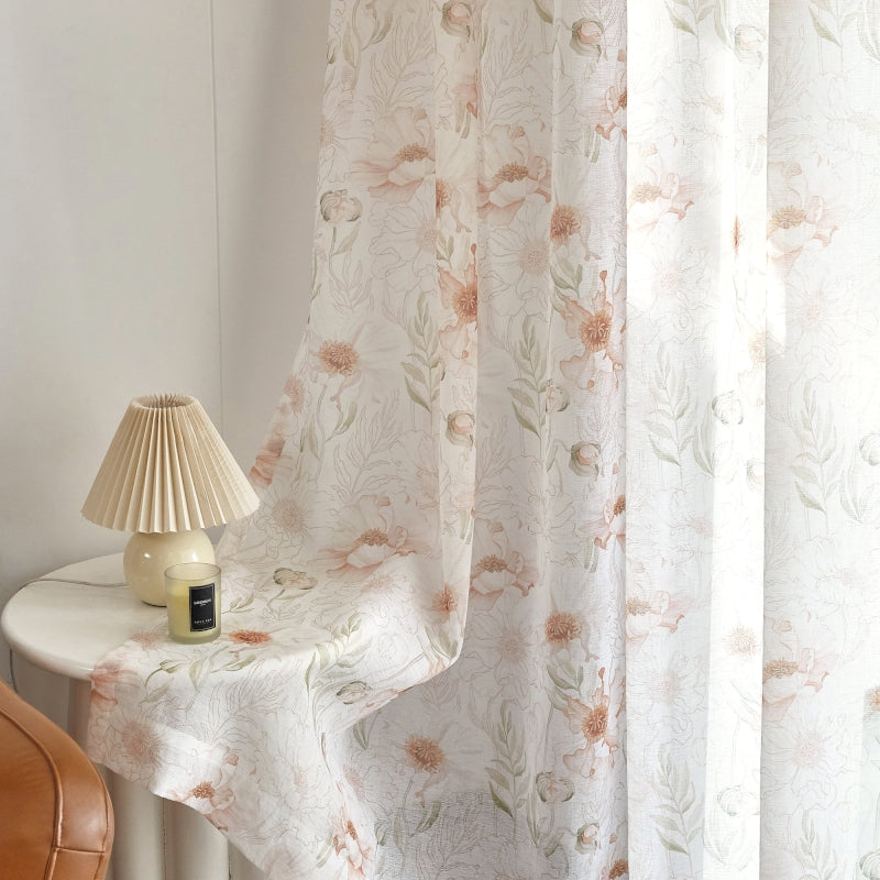 a white table with a lamp and a white curtain