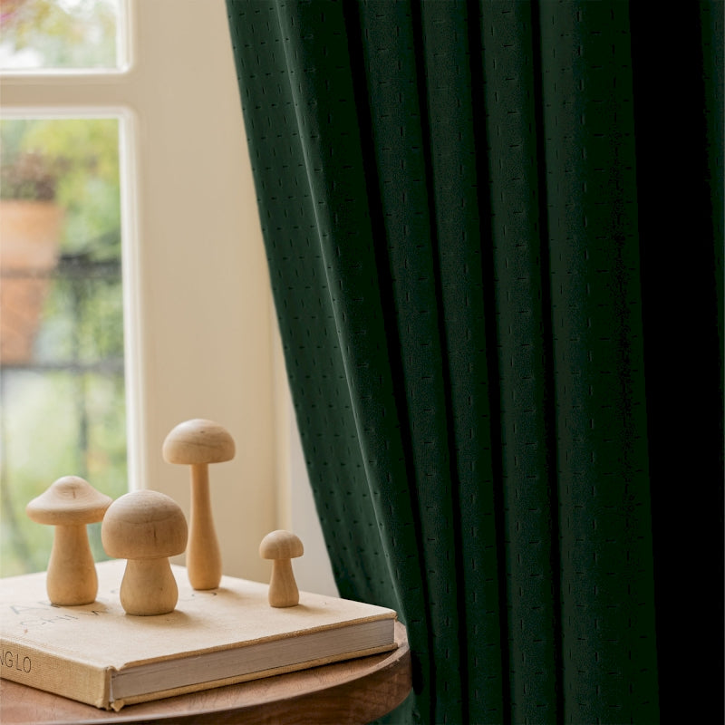 a book sitting on top of a table next to a window