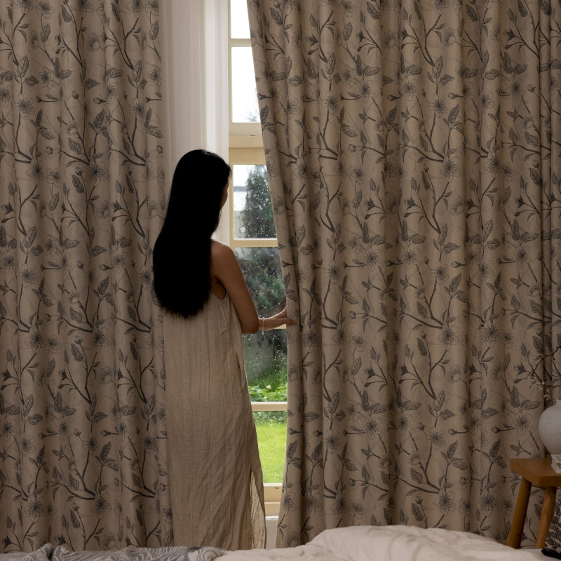 a woman standing in front of a window