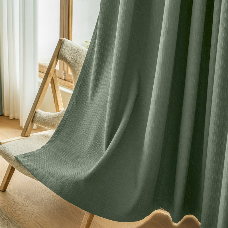 a chair and a curtain in a room