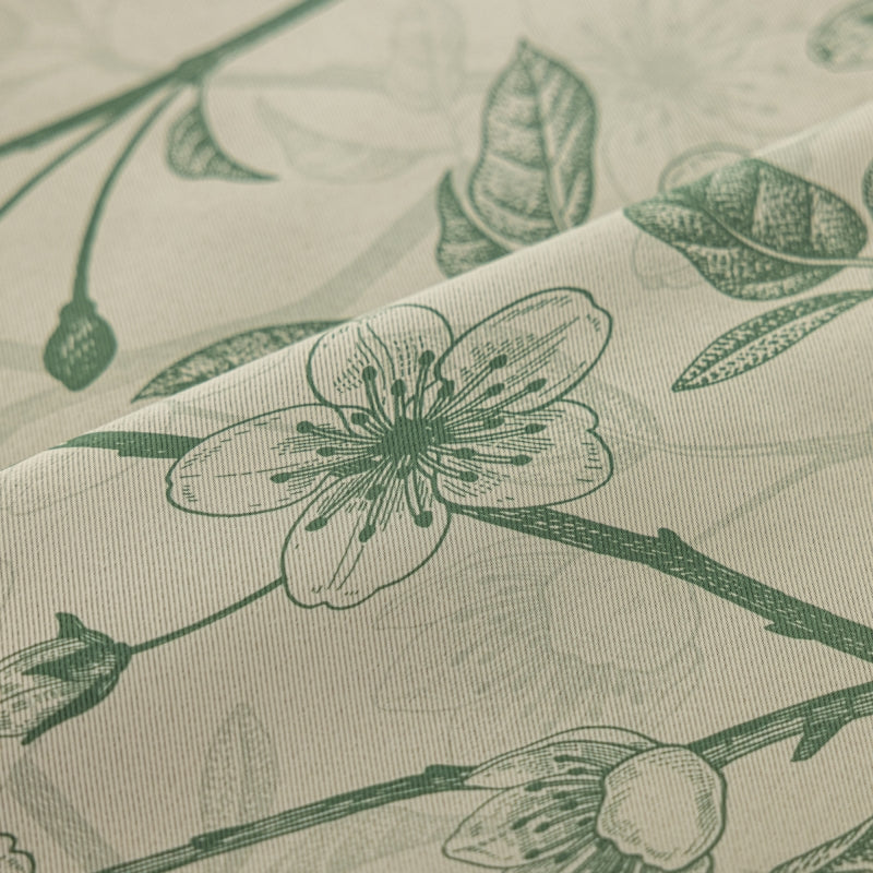 a close up of a flower on a sheet