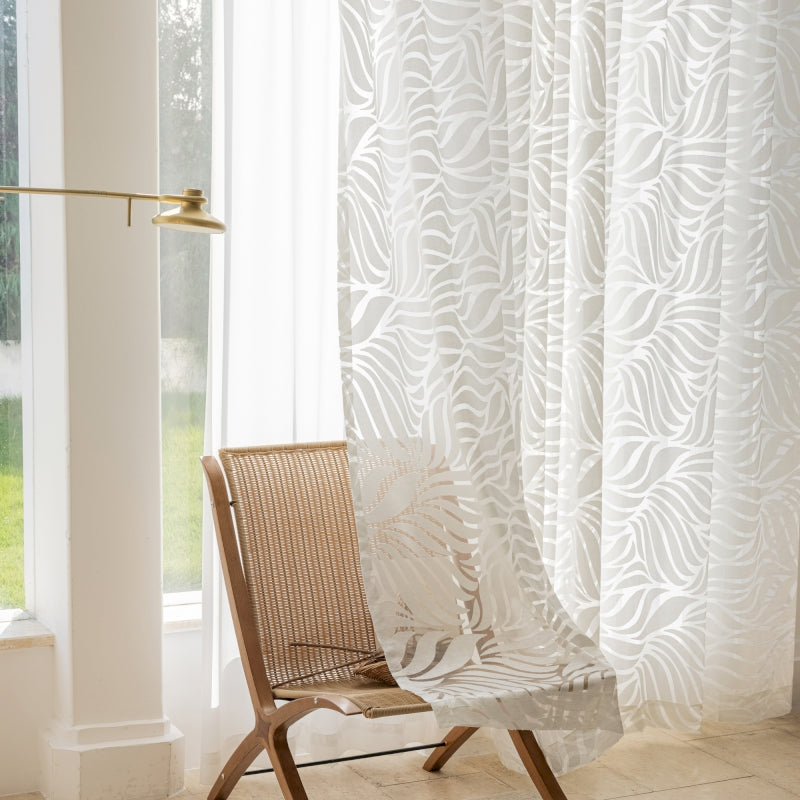 a chair sitting in front of a window