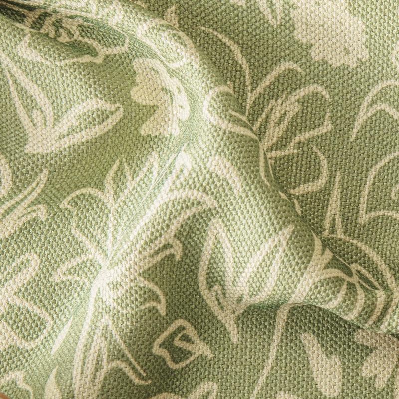 a close up of a green and white fabric