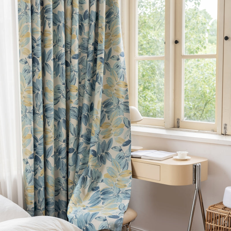 a bedroom with a bed, desk and window