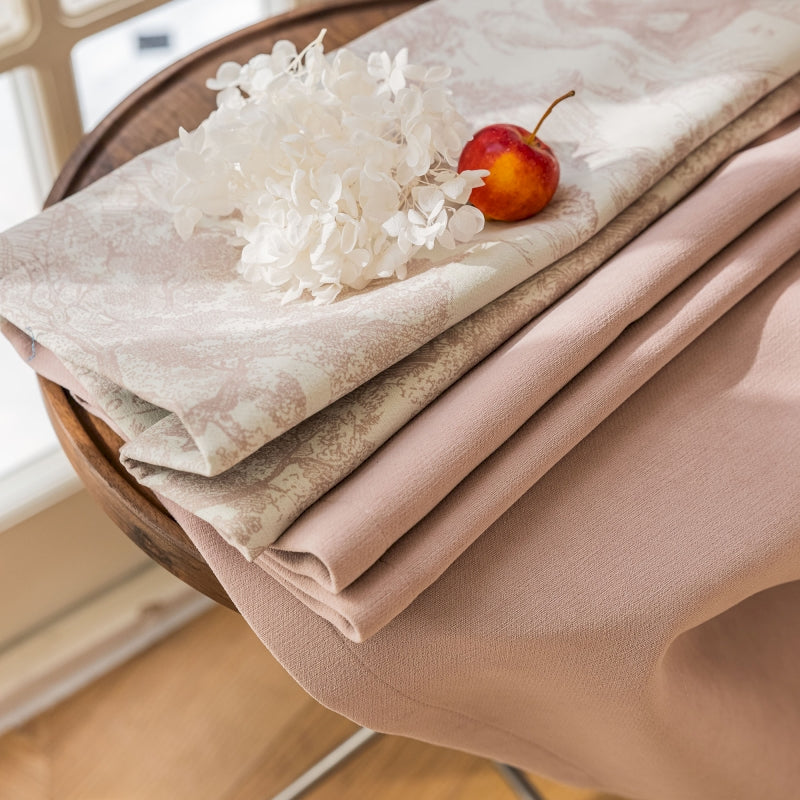 a piece of cloth with a cherry on top of it