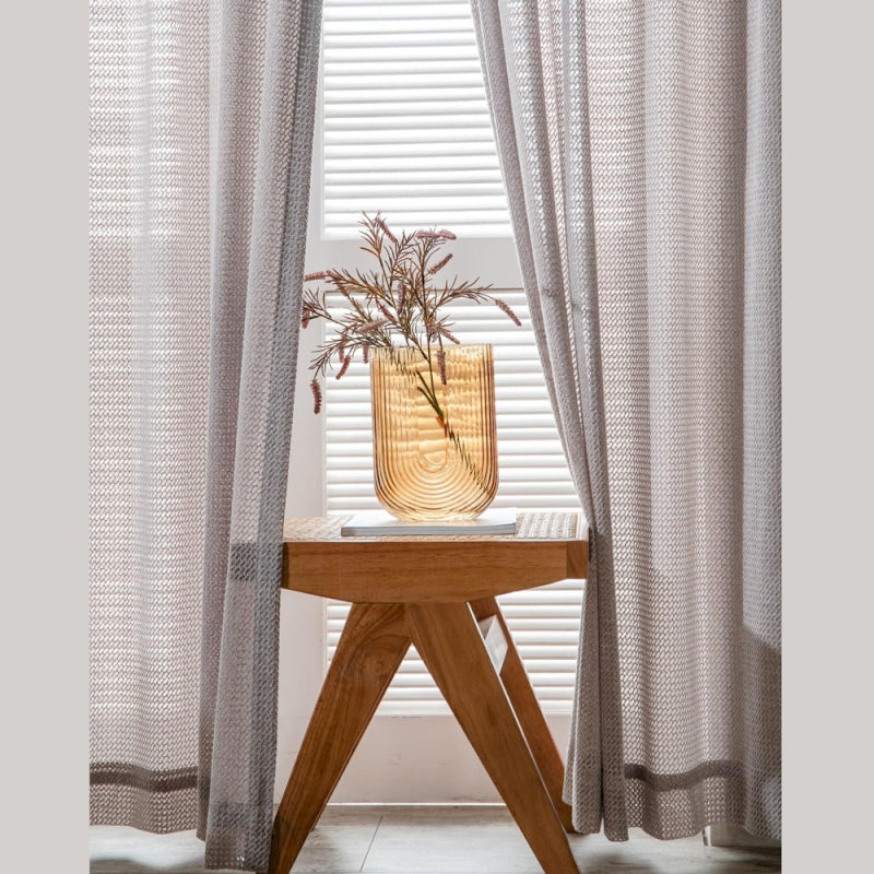 a wooden table with a vase on top of it
