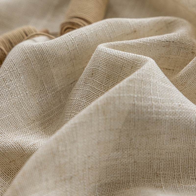 a close up view of a beige fabric