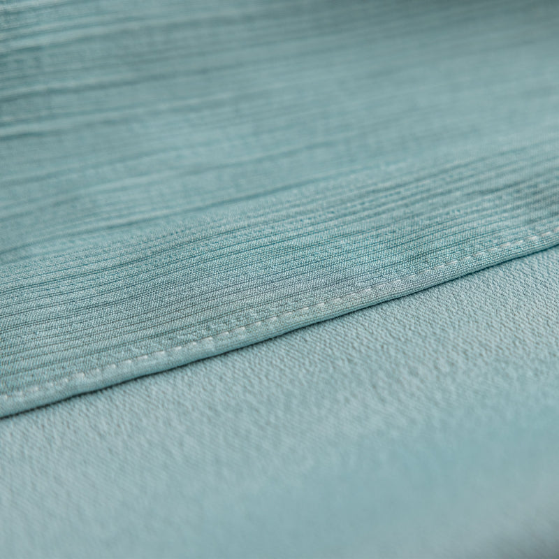 a close up of a light blue fabric