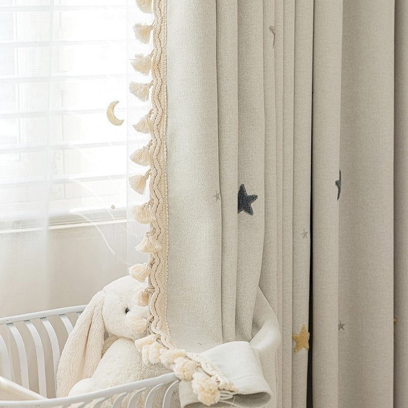 a teddy bear sitting in a crib next to a window