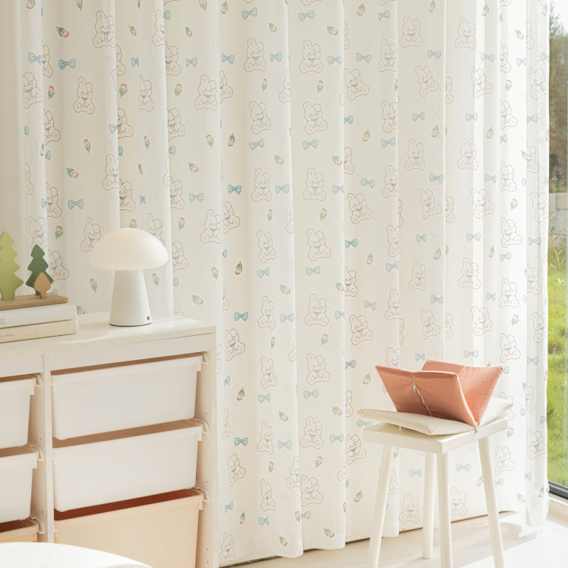 a room with a window and a white dresser