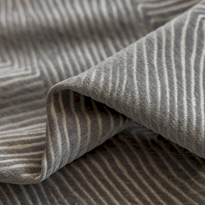 a close up of a gray and white striped fabric