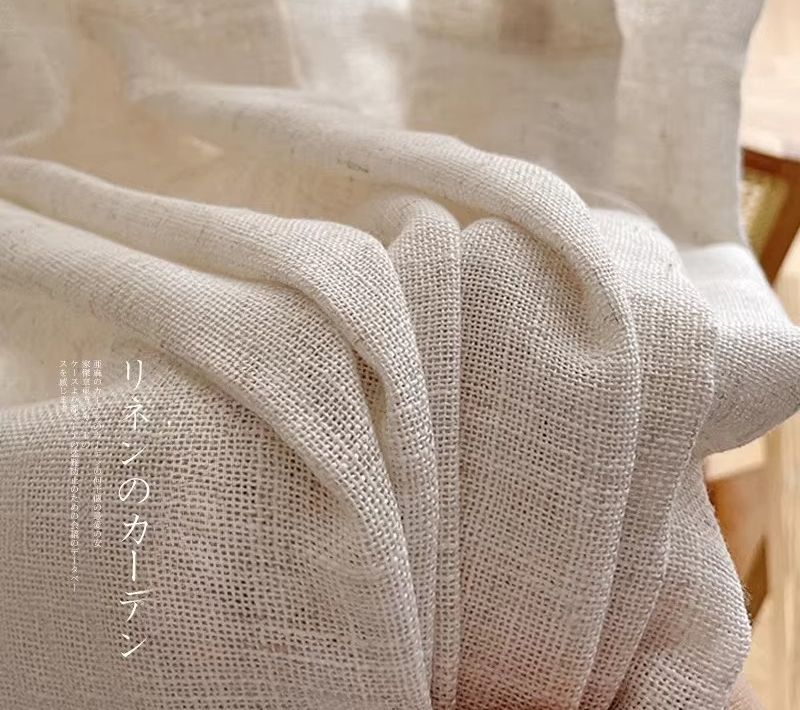 a close up of a chair with a white curtain