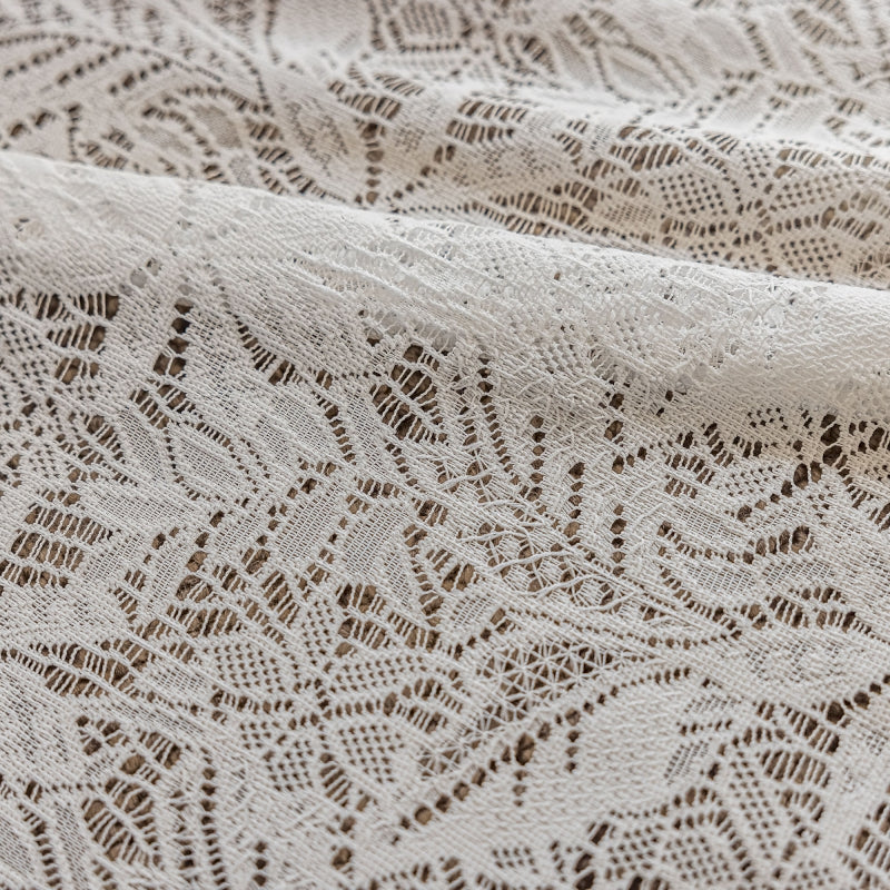 a close up of a white lace fabric