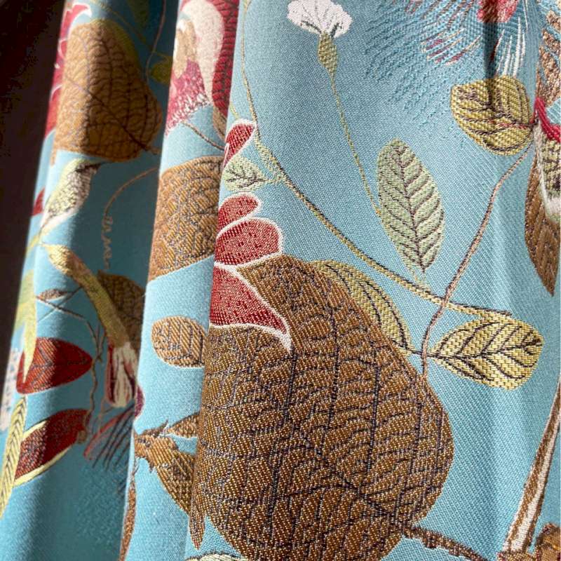a close up of a curtain with a flower pattern