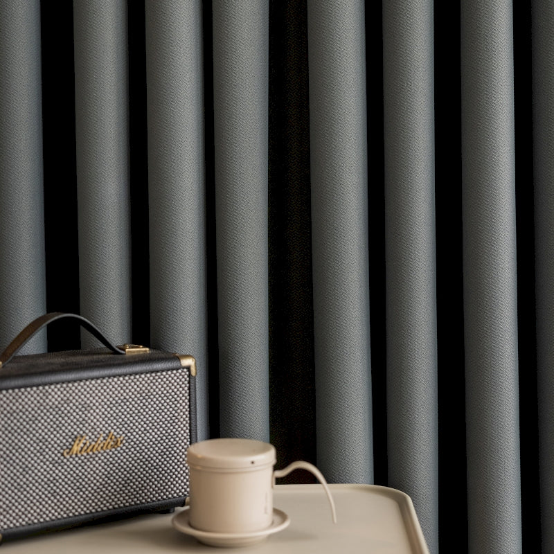 a suitcase sitting on top of a table next to a cup of coffee