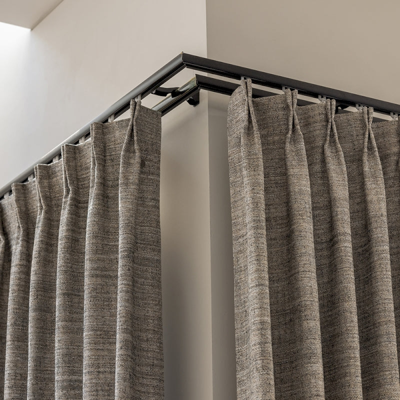 a close up of a curtain with a metal rod