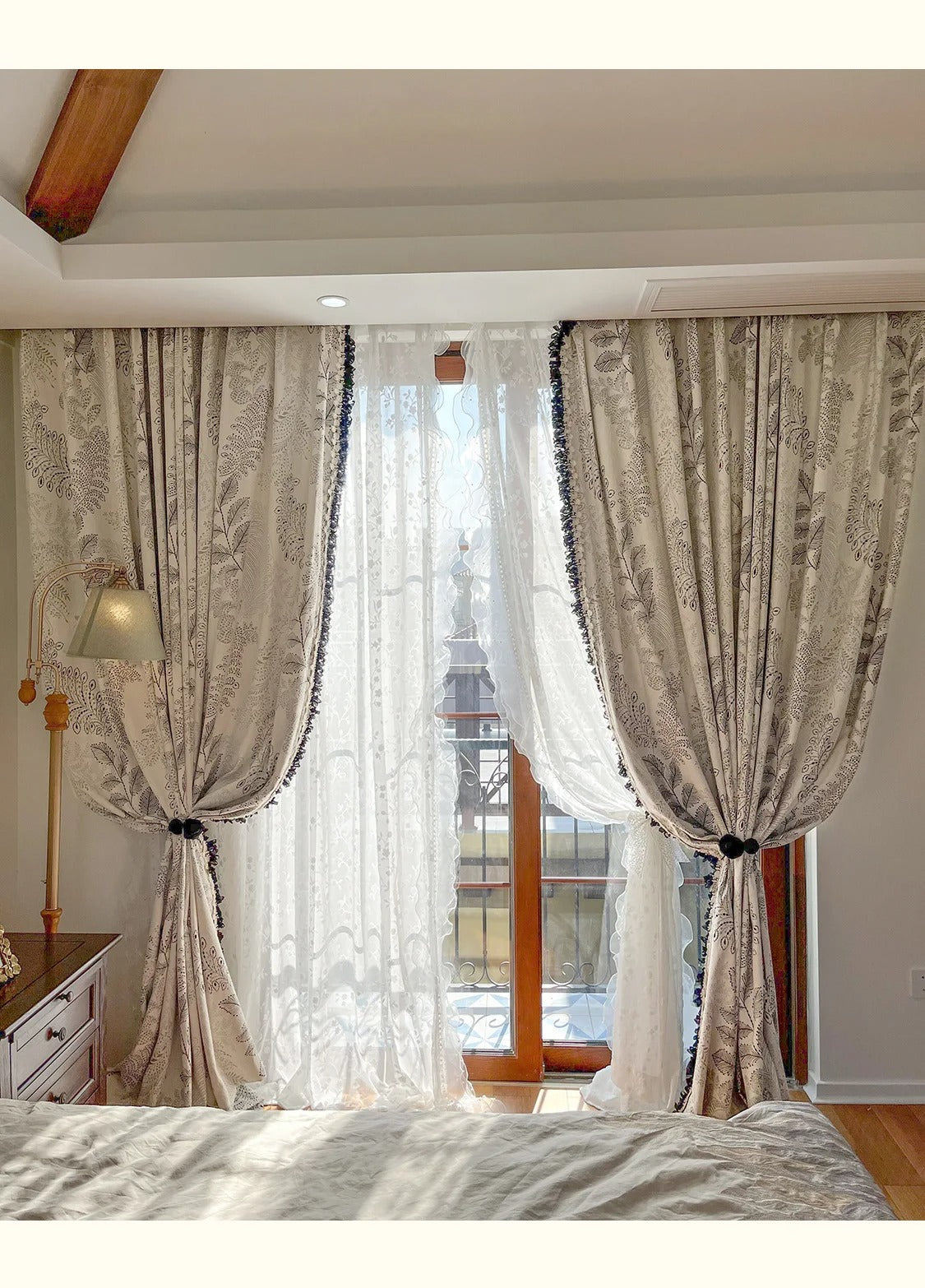 a bed room with a neatly made bed and a window
