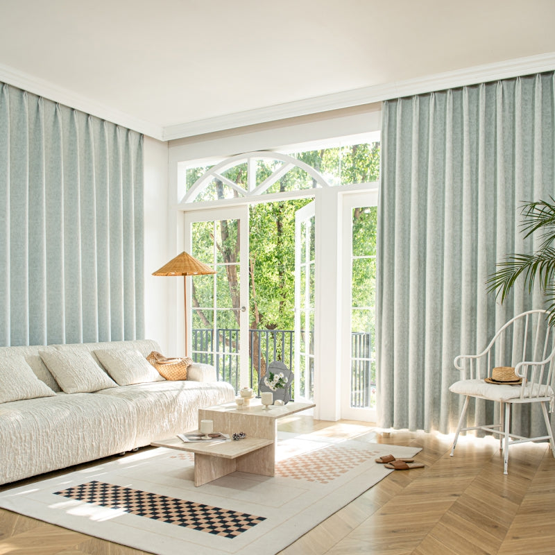 a living room filled with furniture and a large window