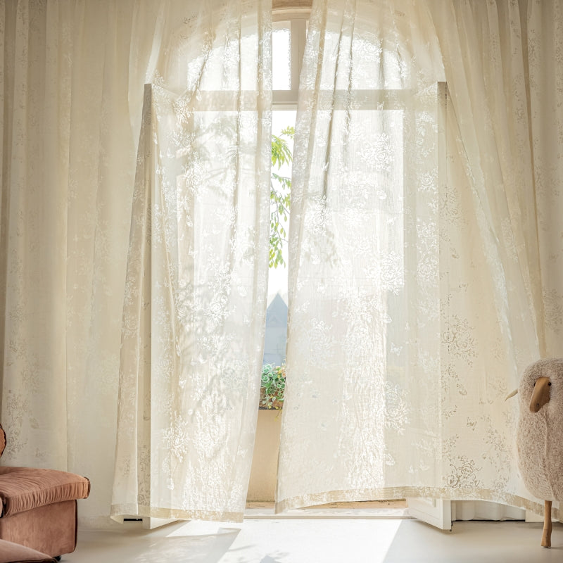 a living room with a chair and a window